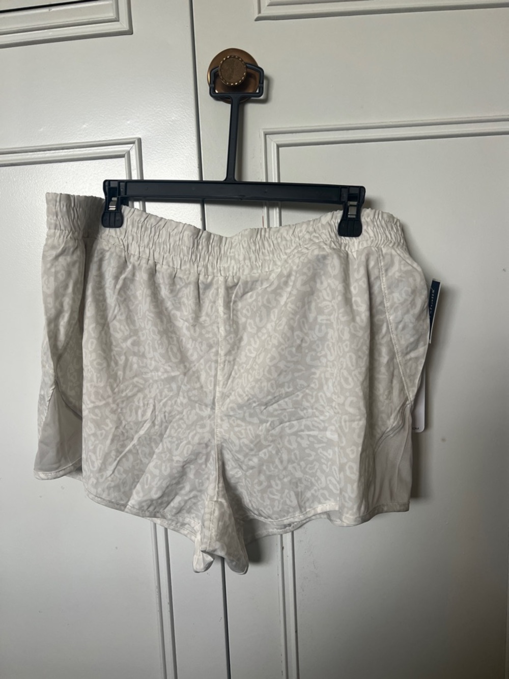White cheetah print athletic shorts